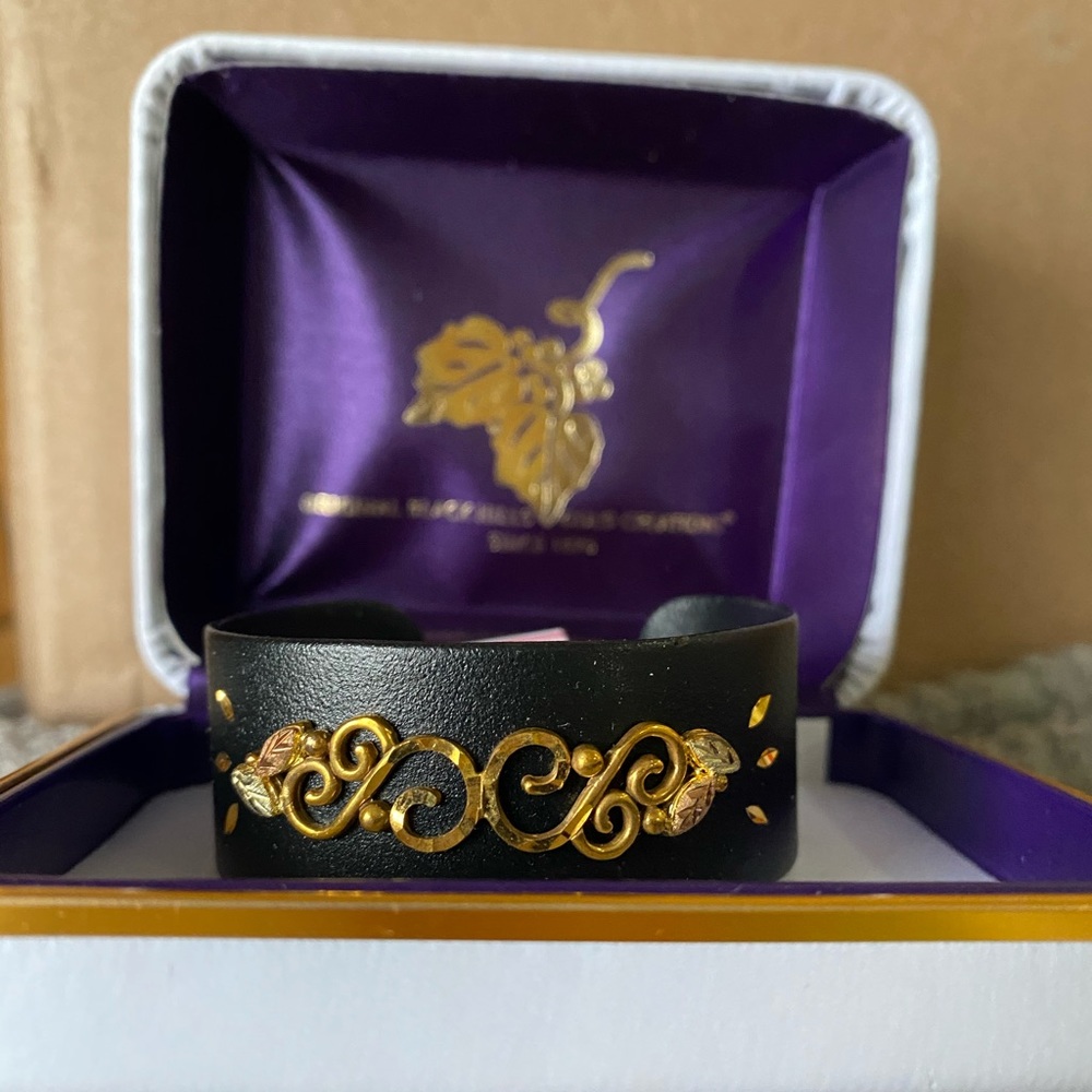 Landstrom’s black & gold cuff bracelet